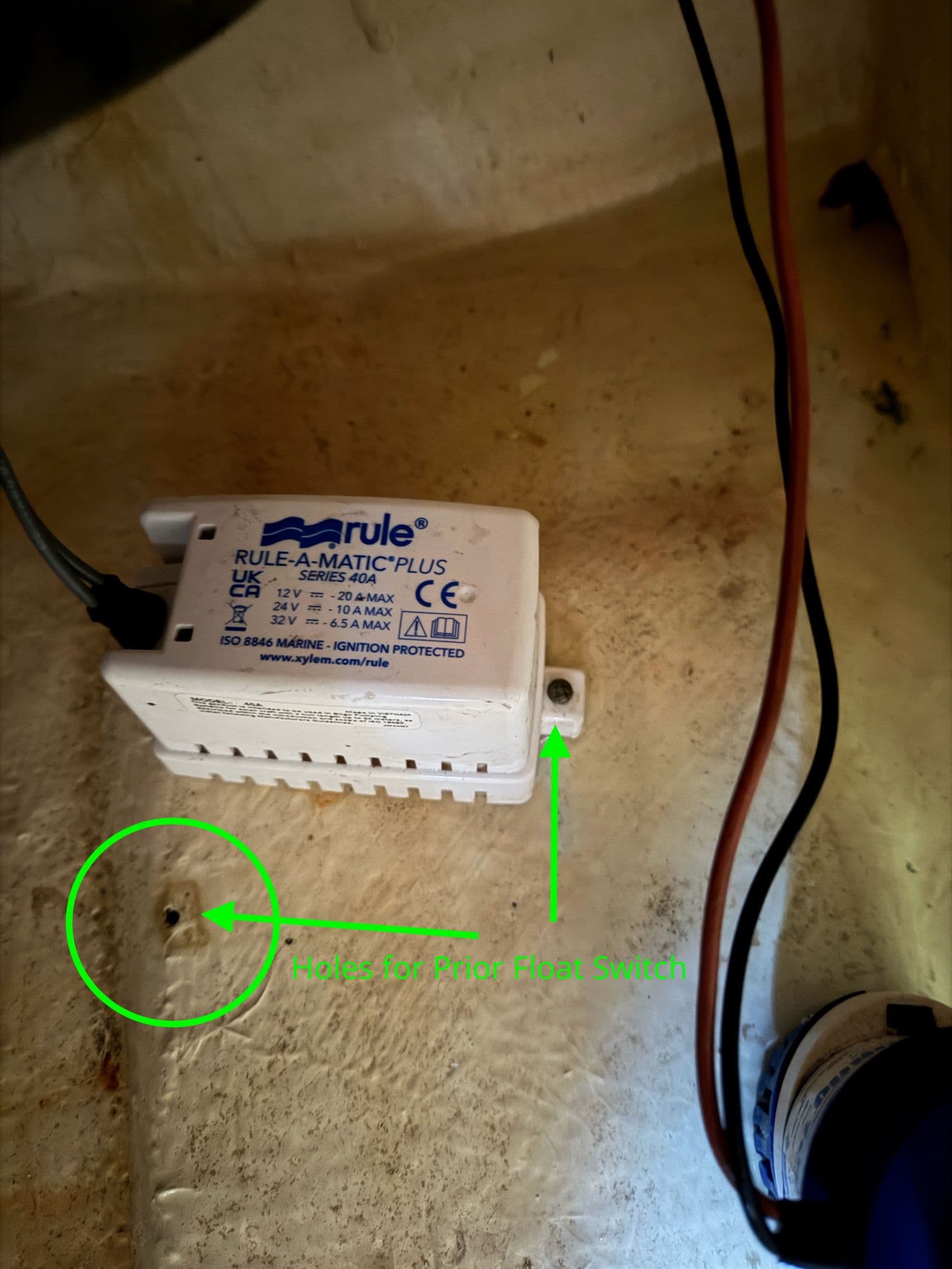 Rule-A-Matic Plus float switch next to unused mounting holes in the bilge