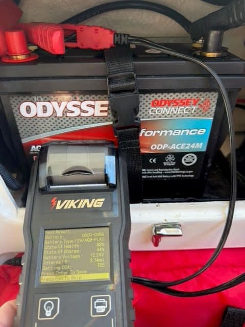Viking battery tester reading the house battery at 0% state of charge, 11.63 volts