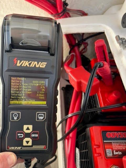 Freshly replaced battery terminals with red protective covers after cleaning and Corrosion-X treatment