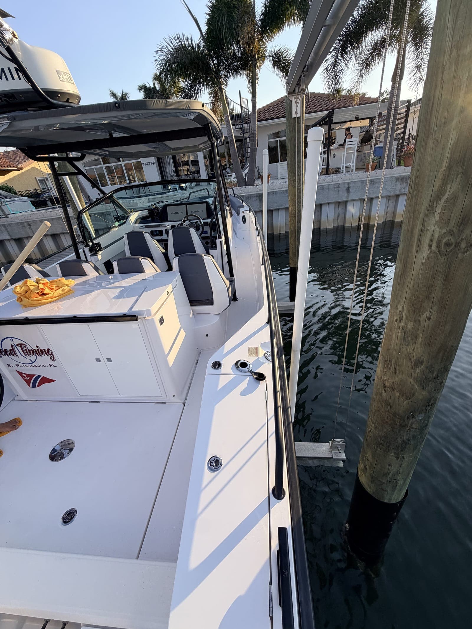 Boat tied up at a private dock in a Tampa Bay residential canal — Mobile Marina runs scheduled detail routes through St. Pete, Clearwater, Tampa, Tierra Verde, and Gulfport so the work happens at your slip