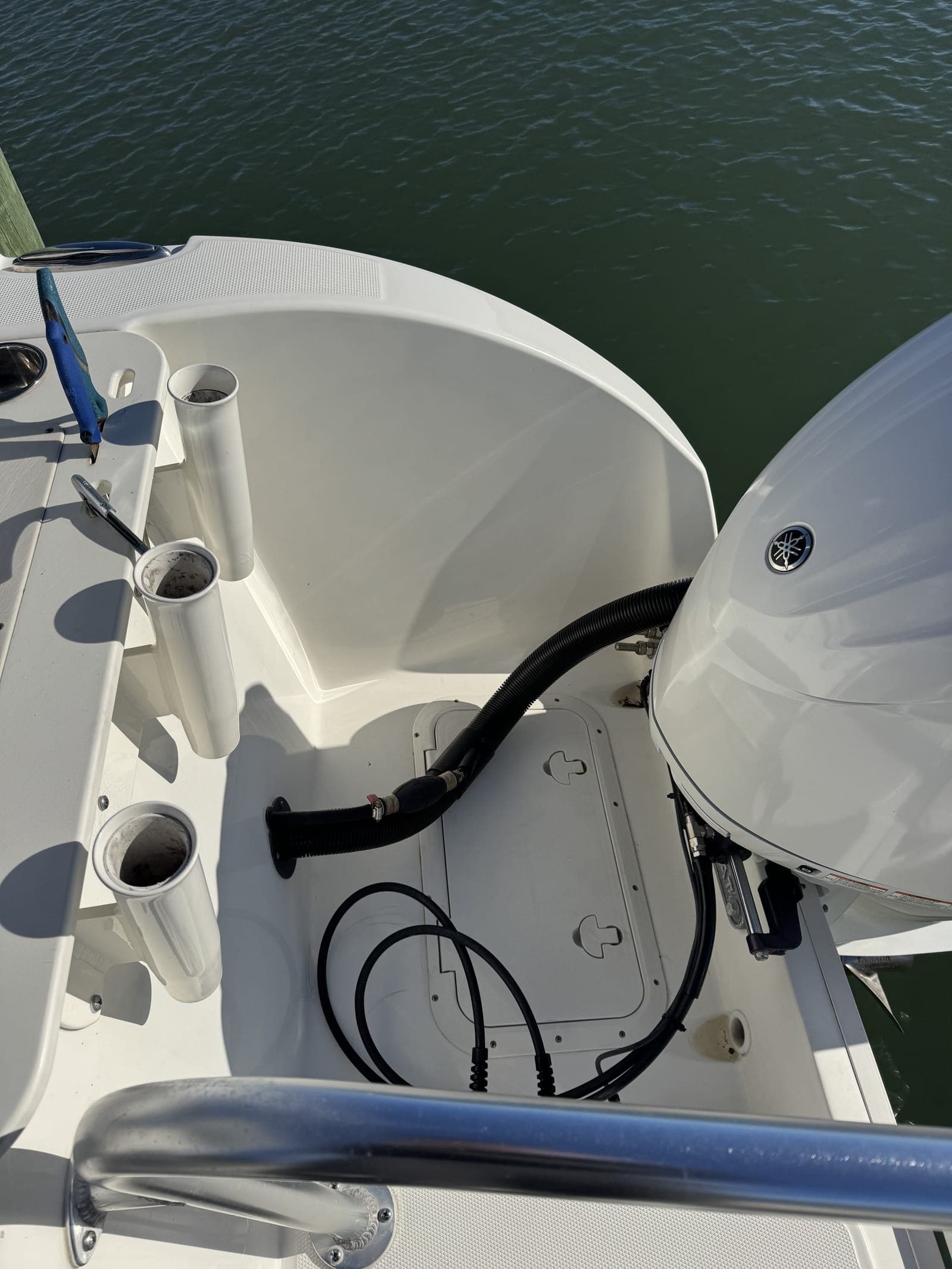 Center console stern compartment after a Mobile Marina full detail — the kind of result owners get when they hand off the wax cycle to a pro