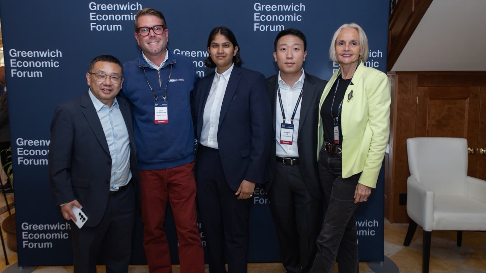 Erik Schroeder with other participants of the Startup World Cup Founders Pitch Contest in front of the Greenwich Economic Forum backdrop