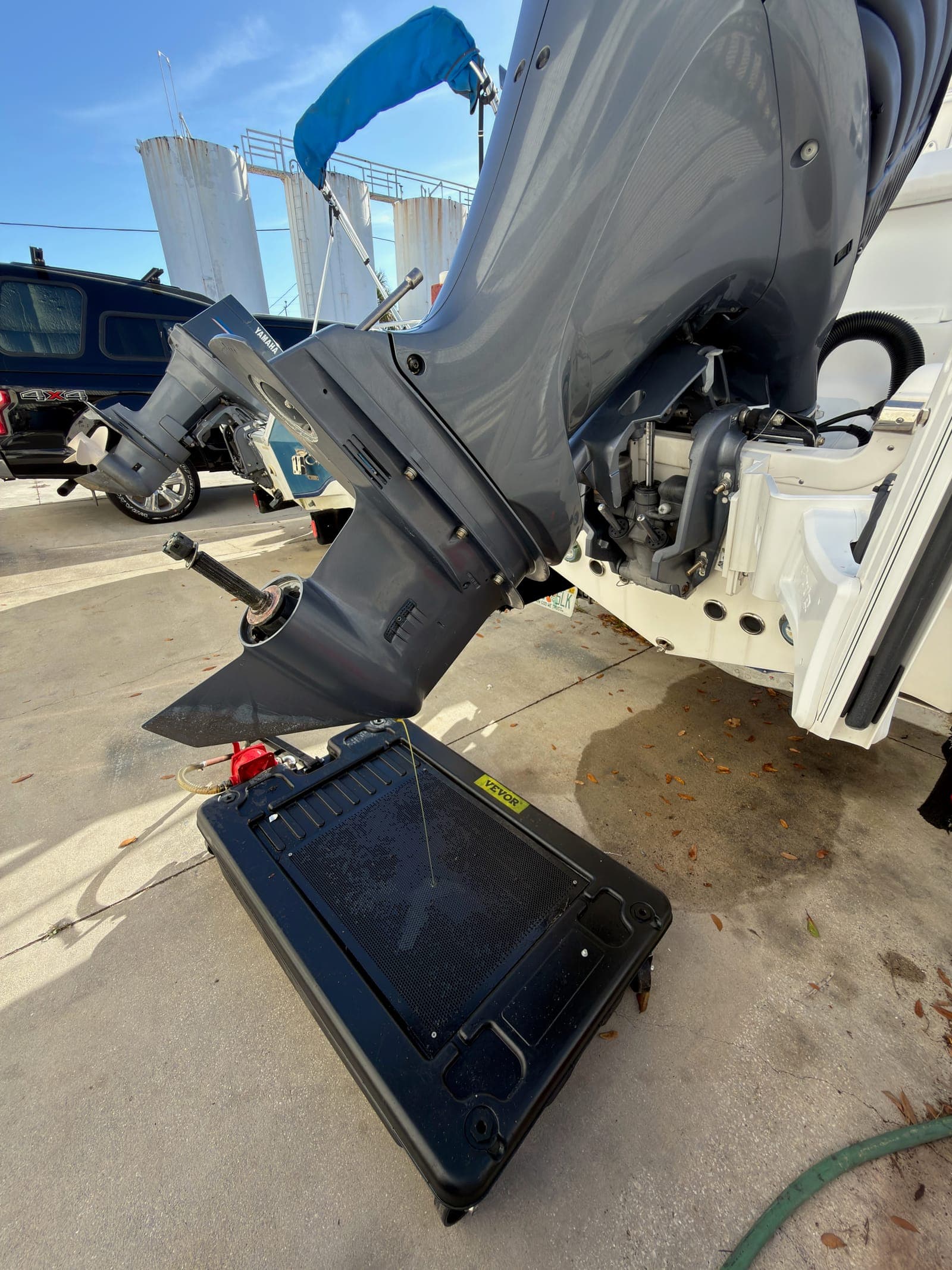 Mobile Marina performing dockside 300-hour outboard service on a Yamaha with the cowling removed for full access to the powerhead