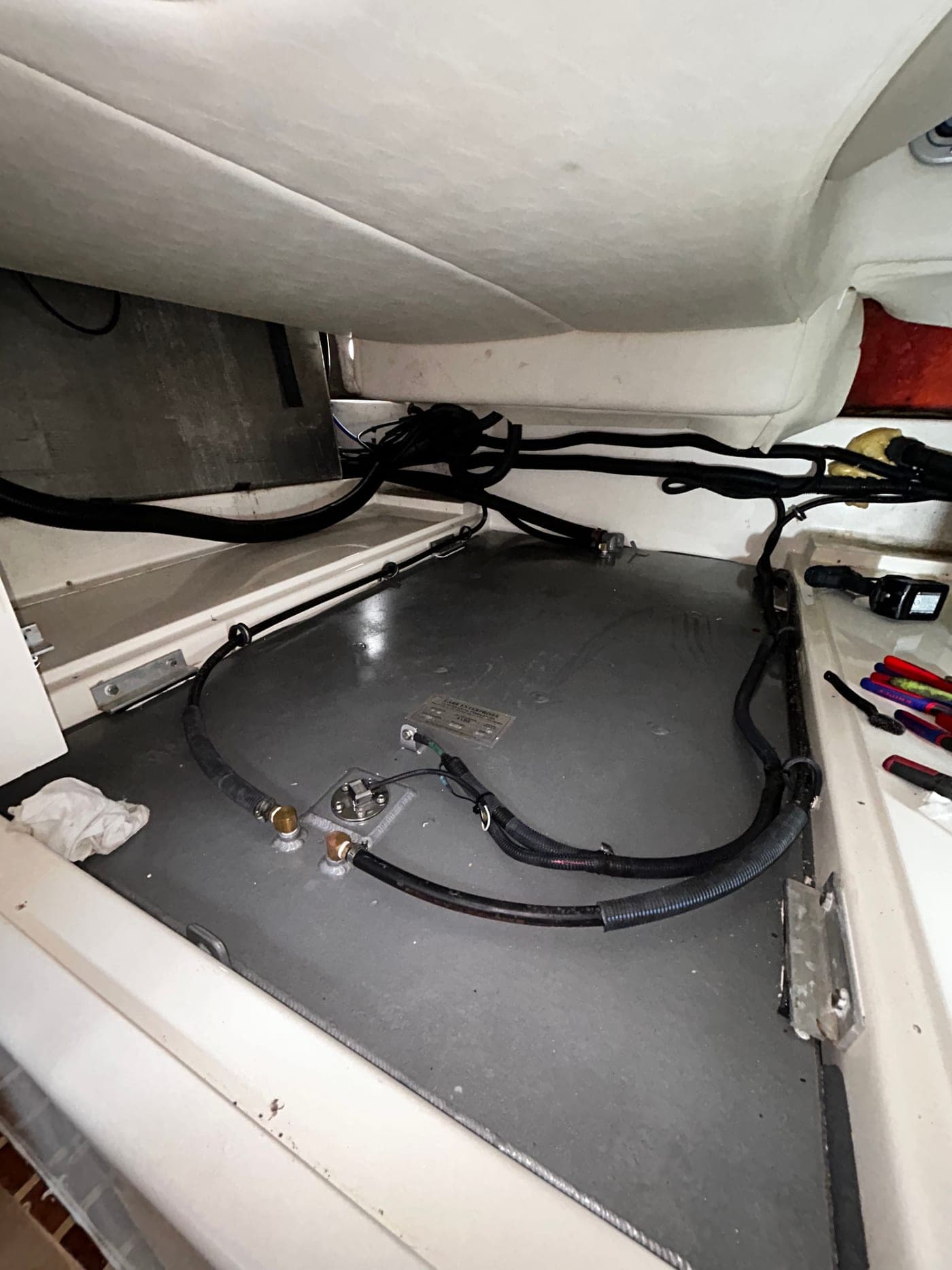 Custom coated aluminum center fuel tank installed in a Boston Whaler 305 with fuel lines and sender wiring connected